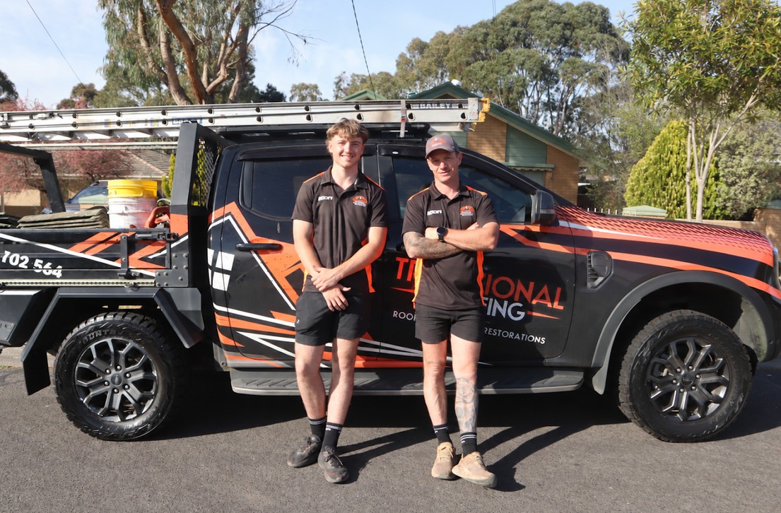The Traditional Roofing team beside the branded company ute