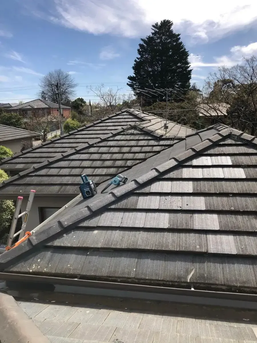 After: damaged concrete tiled roof repaired and re-tiled