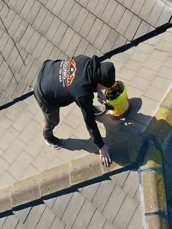 Drone view of our roofer repointing hip capping on a concrete tiled roof