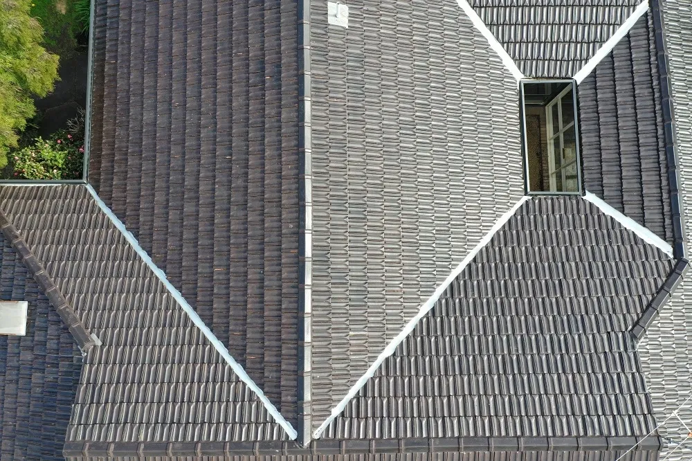 Aerial view of a dark tiled roof with new valley irons installed