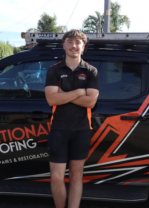 Tait from Traditional Roofing beside the work ute
