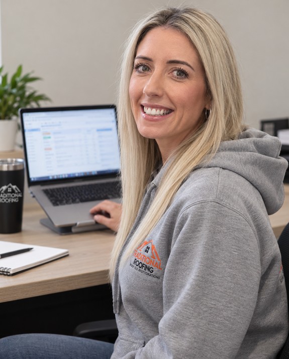 Brooke from Traditional Roofing at the office desk